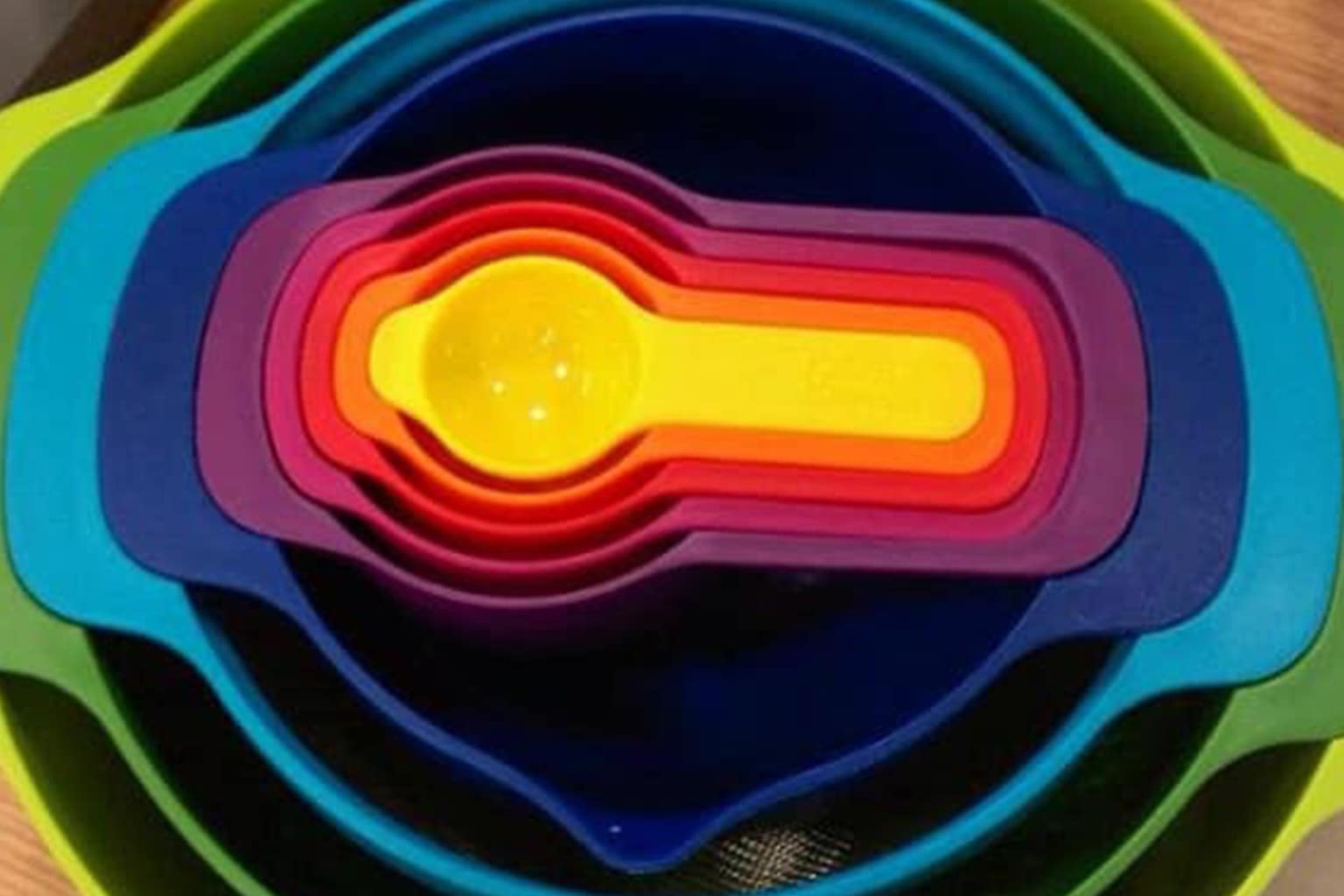 Satisfying photos compilation: A collage featuring Froot Loops sorted into a perfect color-gradient square in a bowl of milk, a vacuum head fitting exactly into a narrow corner, and recursive yellow van windows creating an infinity effect.