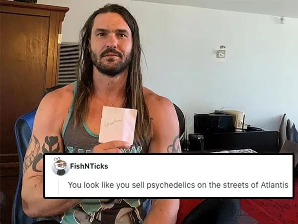 A r/roastme entry of a muscular, long-haired man in a tank top, roasted for looking like he spent his life selling "psychedelics on the streets of Atlantis."