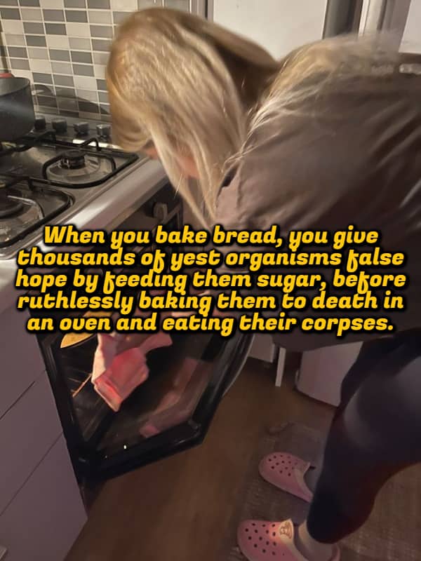 Woman putting bread into an oven with a dark shower thought about yeast organisms.