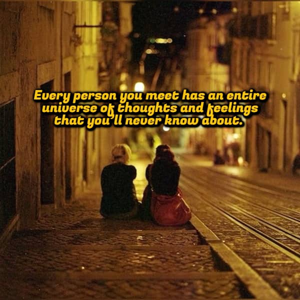 Two people sitting on a street at night with a shower thought about inner universes.