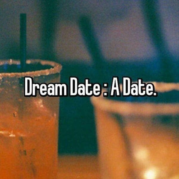 single life meme showing a blurry bar background with text defining a "Dream Date" as just "A Date," highlighting the current desperation of the dating scene.