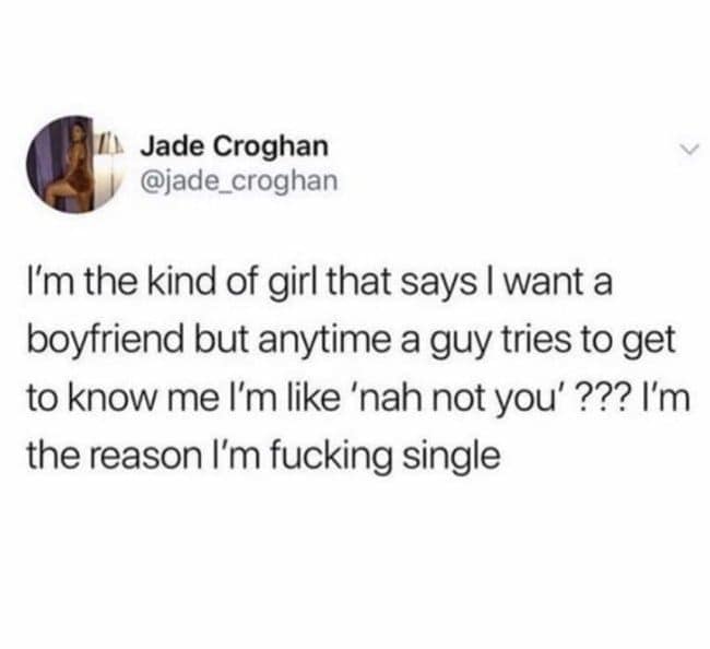 A self-aware single meme tweet from @jade_croghan. She explains the internal struggle of wanting a boyfriend but immediately rejecting any guy who tries to talk to her with a blunt "nah not you," concluding that she is the sole architect of her own singleness.