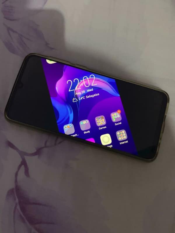 A smartphone screen suffering a catastrophic graphical tech fail where the entire operating system UI has rotated 45 degrees, clipping the icons and clock against a void of dead black pixels.