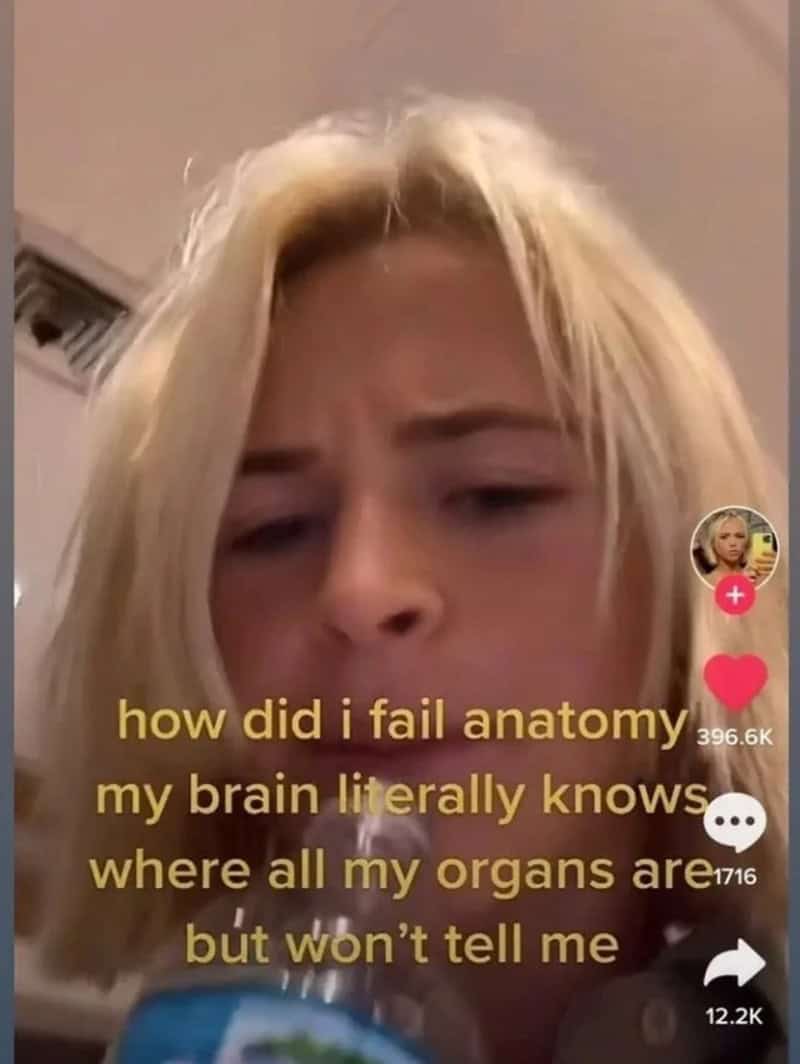 A technically correct meme featuring a close-up of a blonde girl with text over her face. The caption reads, "how did i fail anatomy my brain literally knows where all my organs are but won't tell me," highlighting the frustrating divide between subconscious biological knowledge and academic recall.