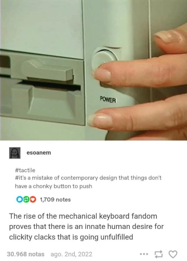 technology meme focusing on the tactile nature of vintage hardware, showing a hand pressing a large, round power button on a cream-colored machine with a caption about the unfulfilled desire for chunky buttons.