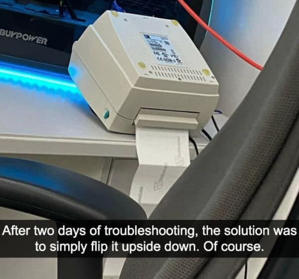technology meme depicting a piece of white office hardware sitting upside down on a desk, illustrating a bizarre troubleshooting success story.