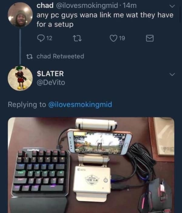 technology meme showing a "frankenstein" PC setup where a small smartphone serves as the monitor for a mechanical gaming keyboard and mouse.