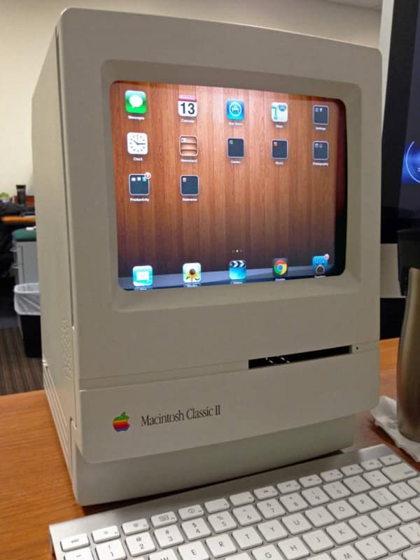 technology meme featuring a vintage Macintosh Classic II computer case that has been modified to house a modern iPad, blending 80s aesthetics with current hardware.