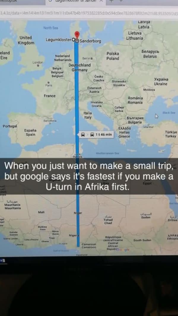 technology meme capturing a massive GPS glitch where a short local trip is routed as a vertical line through the entire continent of Africa and back.