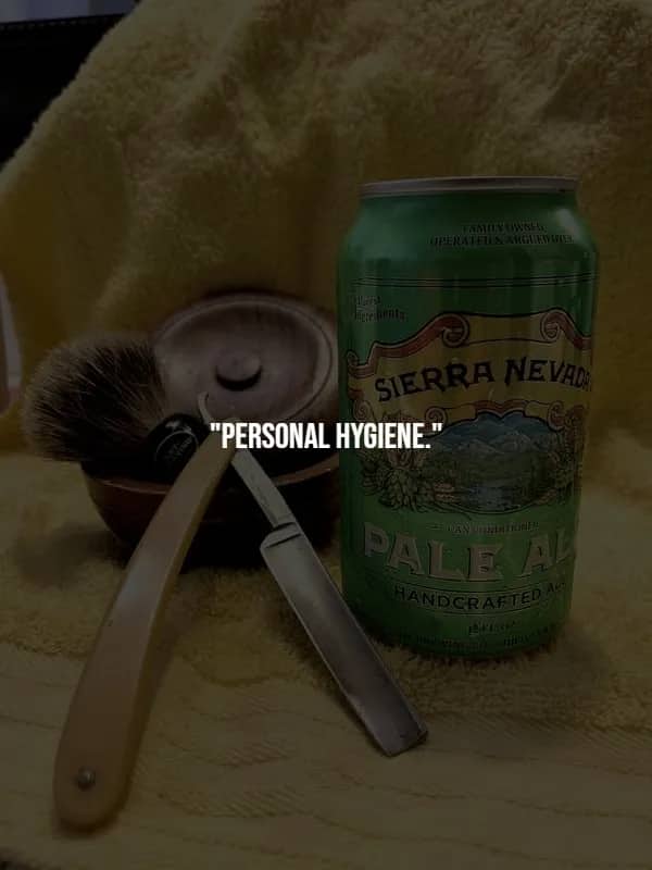Vintage straight razor and shaving brush beside a Sierra Nevada Pale Ale can on a plush towel, representing grooming basics.