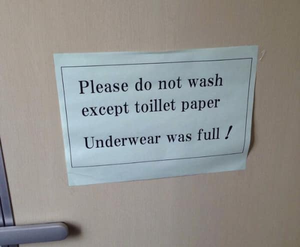 A confusing and slightly gross translation fail on a bathroom door sign. It attempts to instruct users on what to flush but ends with a bizarre statement: "Please do not wash except toillet paper Underwear was full!"