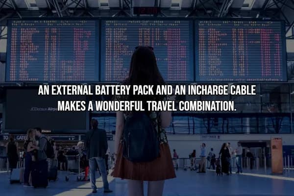 A travel hack for staying powered up, showing a woman in an airport terminal looking up at a massive flight departure board. The text reads: AN EXTERNAL BATTERY PACK AND AN INCHARGE CABLE MAKES A WONDERFUL TRAVEL COMBINATION. It emphasizes the importance of portable power for modern digital nomads.