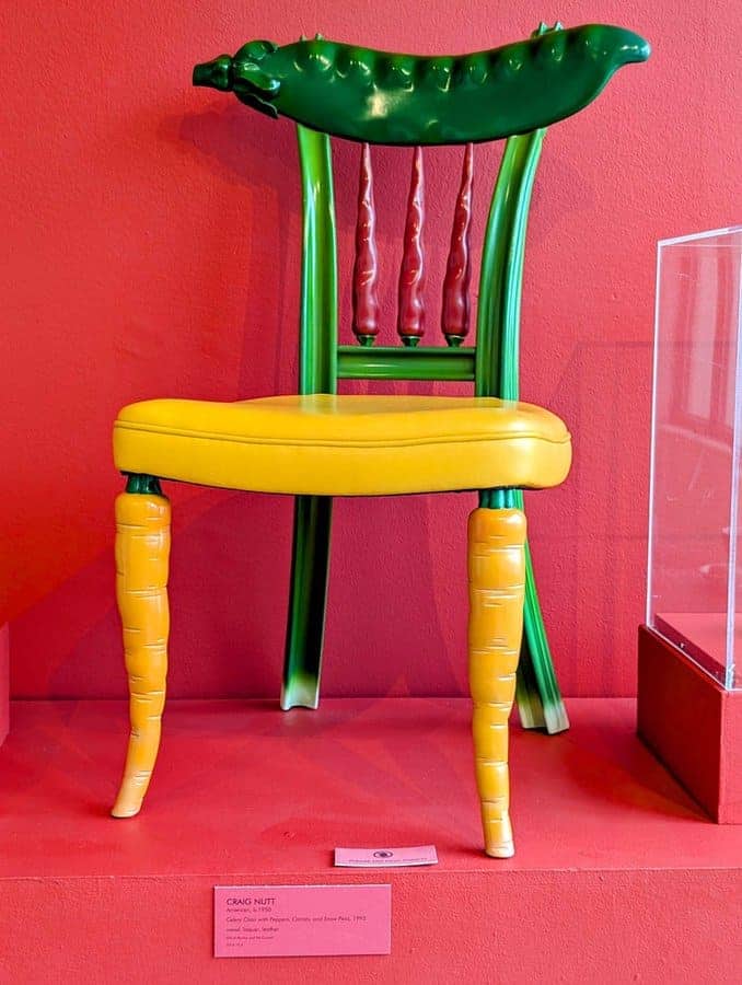 Craig Nutt art chair with celery back pepper spindles carrot legs and yellow seat cushion