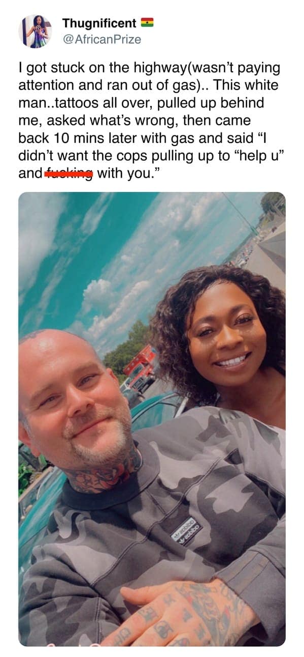 A perspective-shifting wholesome meme tweet. A woman shares a selfie with a heavily tattooed man who brought her gas when she was stranded on the highway, specifically so he could help her before police arrived to potentially escalate the situation.