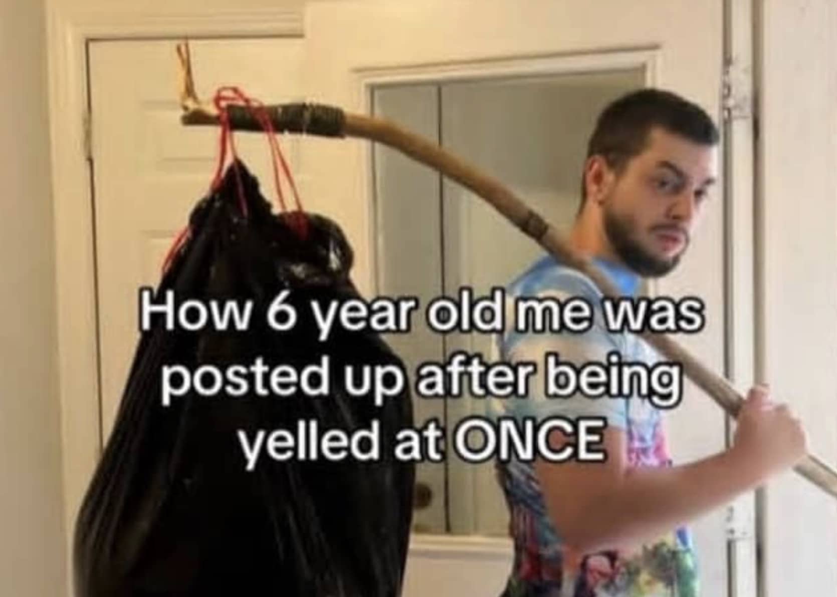 Man holding makeshift bindle at doorway representing dramatic reaction of child running away from home.