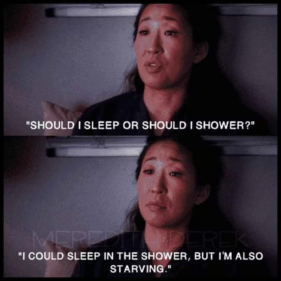 Sandra Oh from Grey's Anatomy looking completely exhausted, illustrating the impossible post-shift choice between sleeping, showering, or finding food.