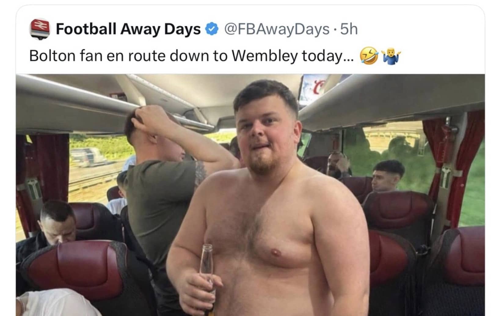 Shirtless Bolton football fan holding a beer bottle on a travel bus en route to Wembley.