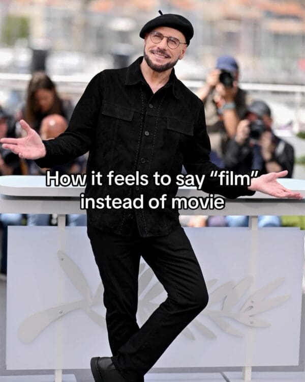 Actor John Travolta's black-clad Cannes appearance is transformed into a viral John Travolta new face meme with text mocking the pretentious feeling of calling a movie a "film."