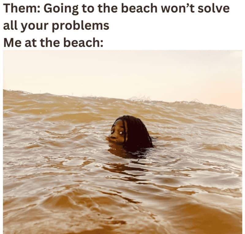 A woman wading deep in the ocean with an intense expression to solve her problems.