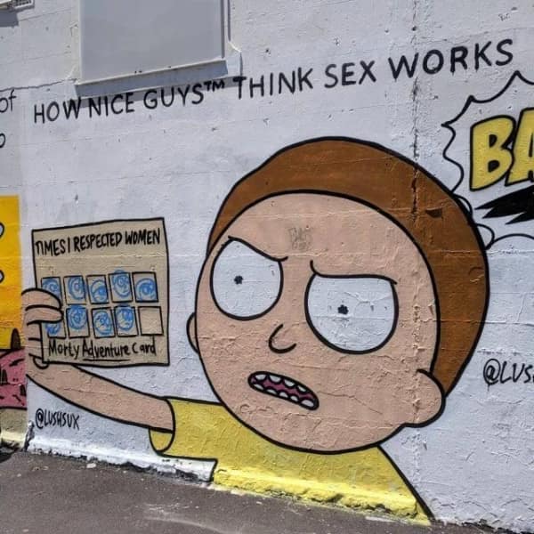 A street art graffiti mural depicts an angry Morty Smith from Rick and Morty holding a loyalty punch card labeled "Times I Respected Women" underneath a satirical text headline about Nice Guy subcultures, anchoring an illustrative blursed image.