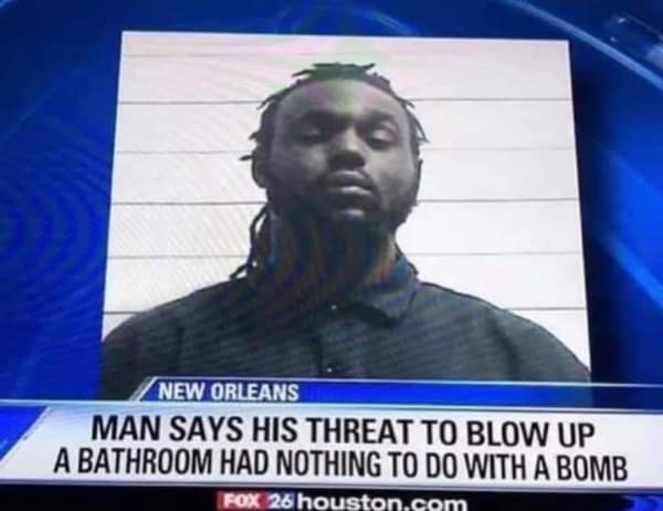 A television news broadcast lower-third graphic showcases a highly amusing criminal headline reading "Man says his threat to blow up a bathroom had nothing to do with a bomb" below a standard police mugshot, shared widely as a popular blursed image.
