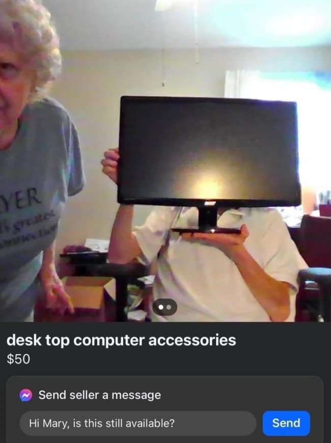 Marketplace listing for "desk top computer accessories" for $50. The photo shows an older man holding a black computer monitor directly in front of his face like a mask, while an older woman stands next to him looking confused.