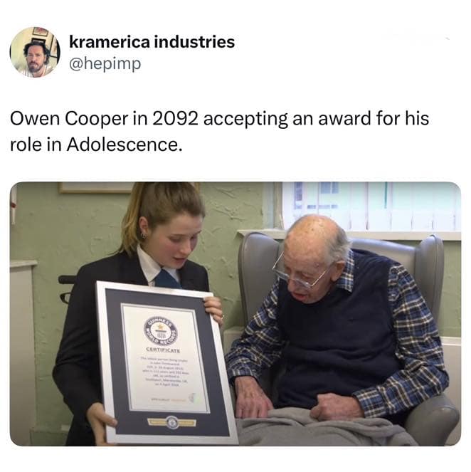 A futuristic british meme tweet from @hepimp showing a 111-year-old man in a nursing home receiving a Guinness World Record certificate, humorously captioned as "Owen Cooper in 2092 accepting an award for his role in Adolescence."