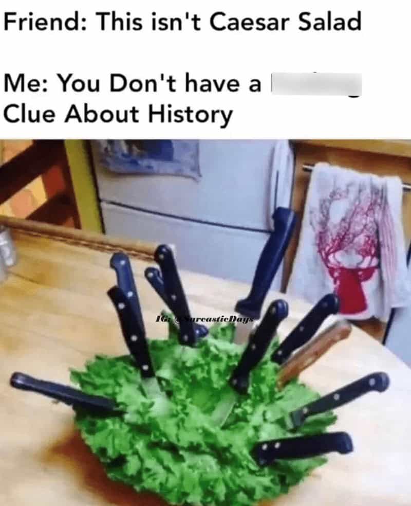 A literal interpretation of a caesar salad meme showing a bowl of plain romaine lettuce stabbed with multiple kitchen knives.