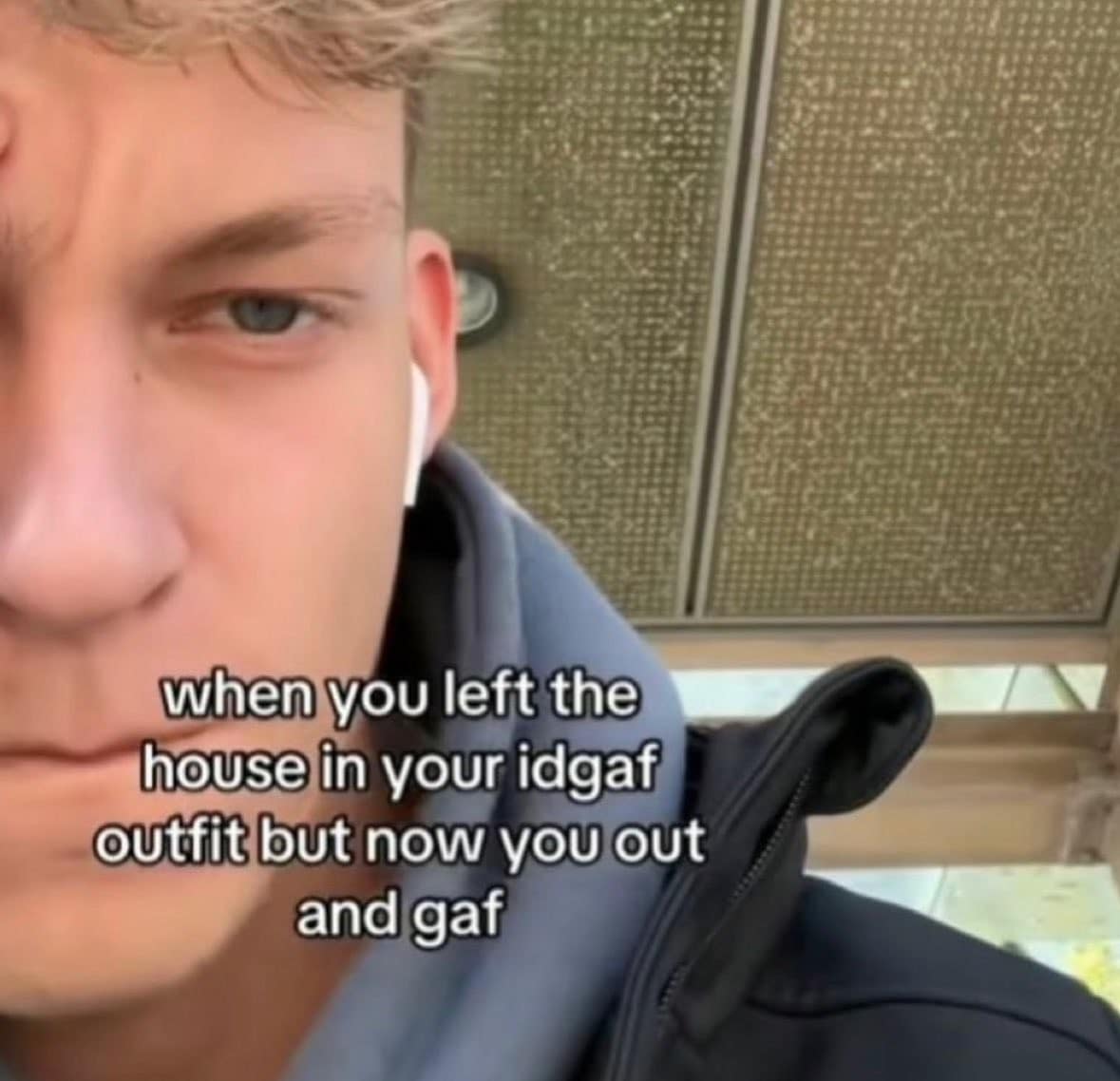 A classic meme featuring a selfie of a young man with a look of sudden, intense regret. The text reads: "when you left the house in your idgaf outfit but now you out and gaf," perfectly capturing the vulnerability of being underdressed in public.