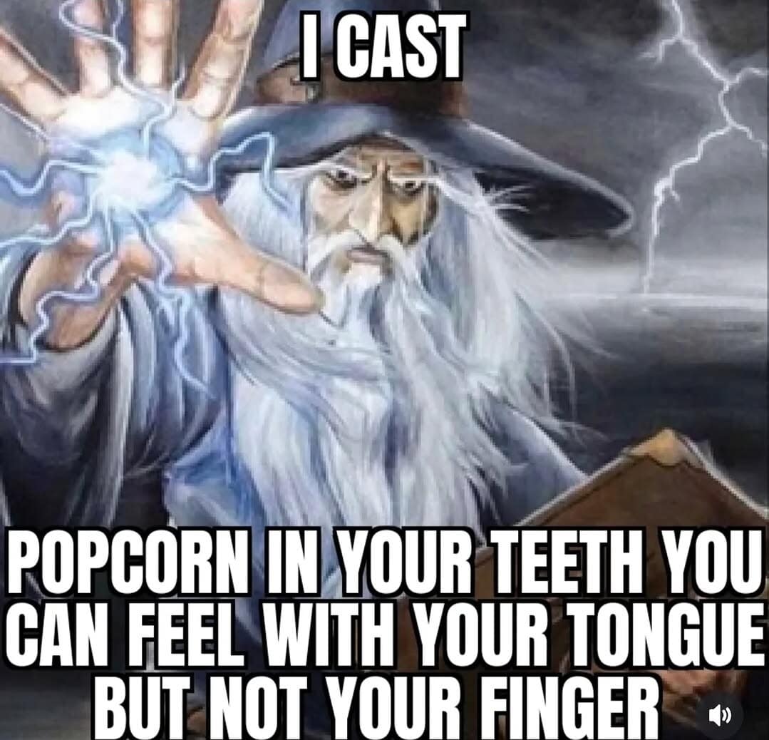 old meme of a fantasy wizard casting a bolt of energy, captioned as a curse: "Popcorn in your teeth you can feel with your tongue but not your finger."