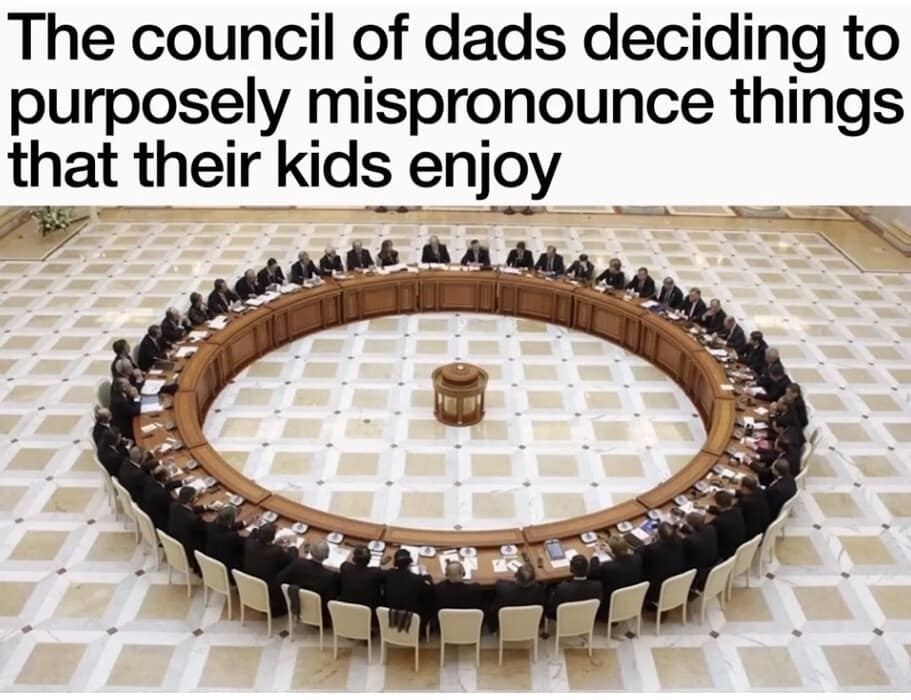 A classic meme using an aerial shot of a massive, formal circular summit table filled with men in suits, captioned "The council of dads deciding to purposely mispronounce things that their kids enjoy."