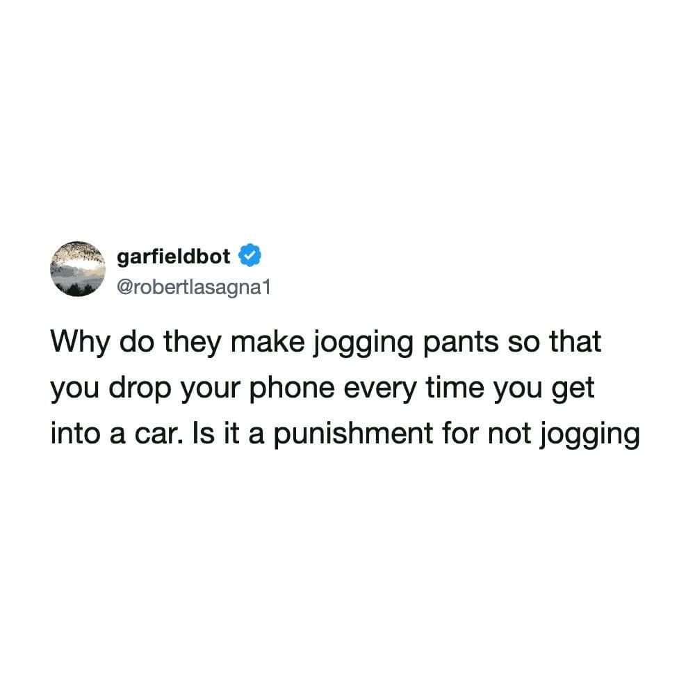 A text-based Twitter post by user garfieldbot captures a highly relatable classic meme questioning why sweatpants and jogging pants are designed to drop a smartphone into the car seat gap immediately upon sitting down.