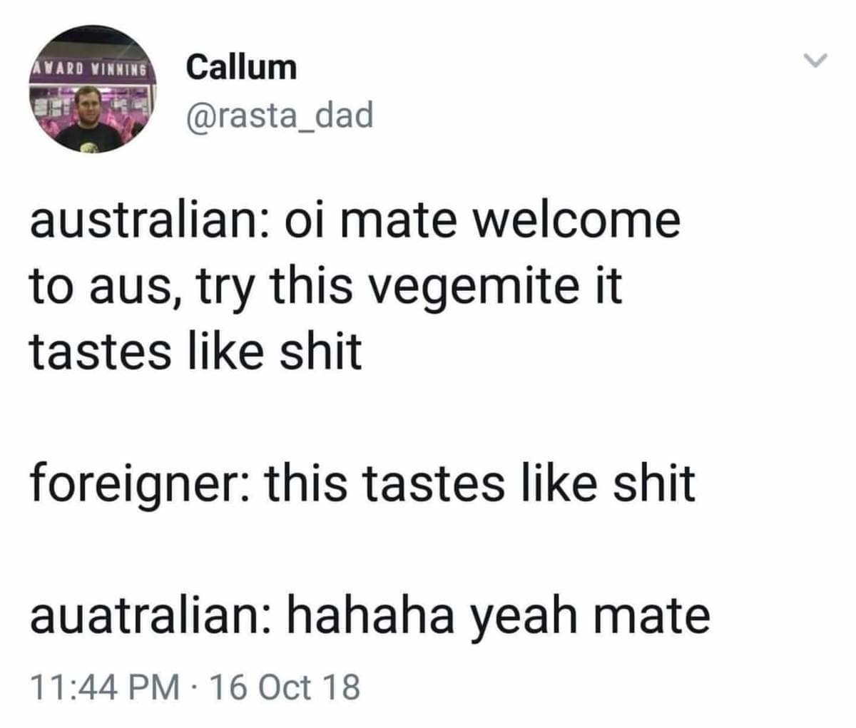A mobile text-post screenshot by user Callum outlines a classic cultural joke about an Australian inviting a foreigner to taste Vegemite while openly admitting it tastes bad, capturing regional internet humor.