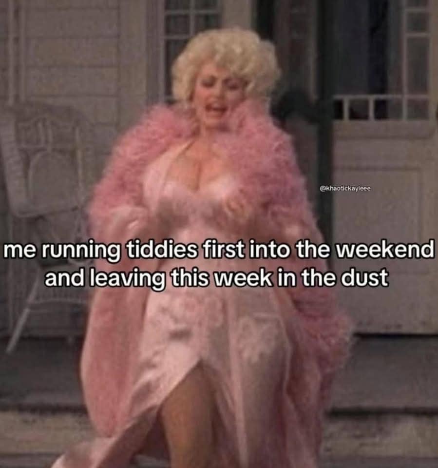 A high-energy classic meme of Dolly Parton in an extravagant pink, ruffled outfit running toward the camera, captioned "me running tiddies first into the weekend."