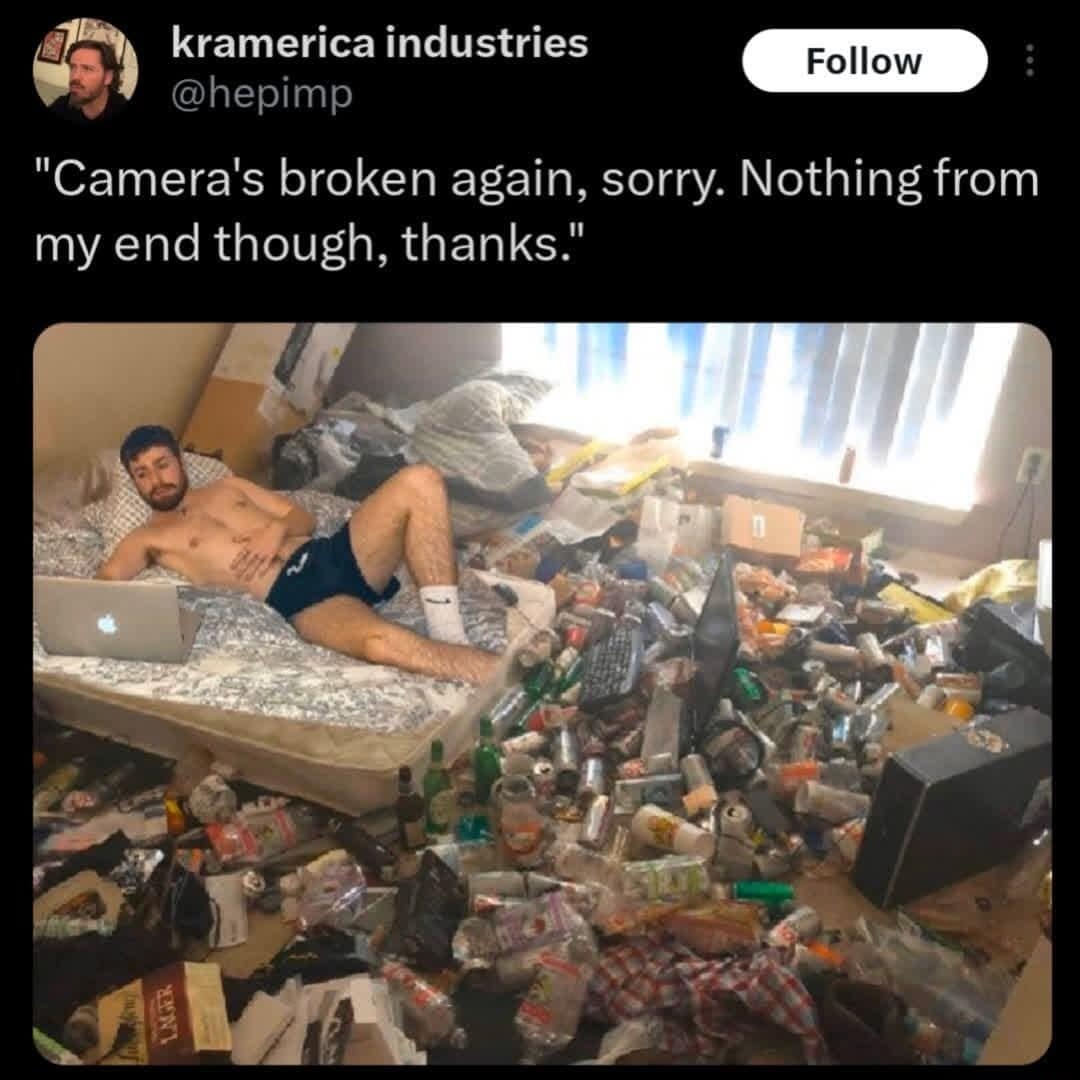 A remote work graphic circulating as one of the web's classic memes shows a tweet by user kramerica industries apologizing for a broken camera on a video call, juxtaposed with a chaotic photo of a shirtless man lying in a bedroom covered wall-to-wall in trash and aluminum cans.
