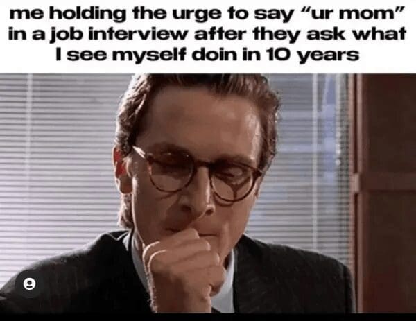 Christian Bale as Patrick Bateman in American Psycho looking intensely focused in this classic meme. The text reads: "me holding the urge to say 'ur mom' in a job interview after they ask what I see myself doin in 10 years."