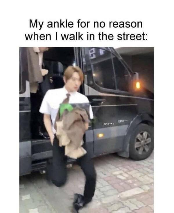 A blurry image of a person rolling their ankle on a flat sidewalk highlights a relatable struggle often seen in the best memes about physical coordination.