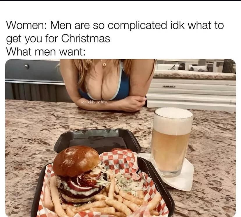 A photo of a double cheeseburger, fries, and a tall beer on a restaurant table serves as a classic meme regarding the simple desires of men.