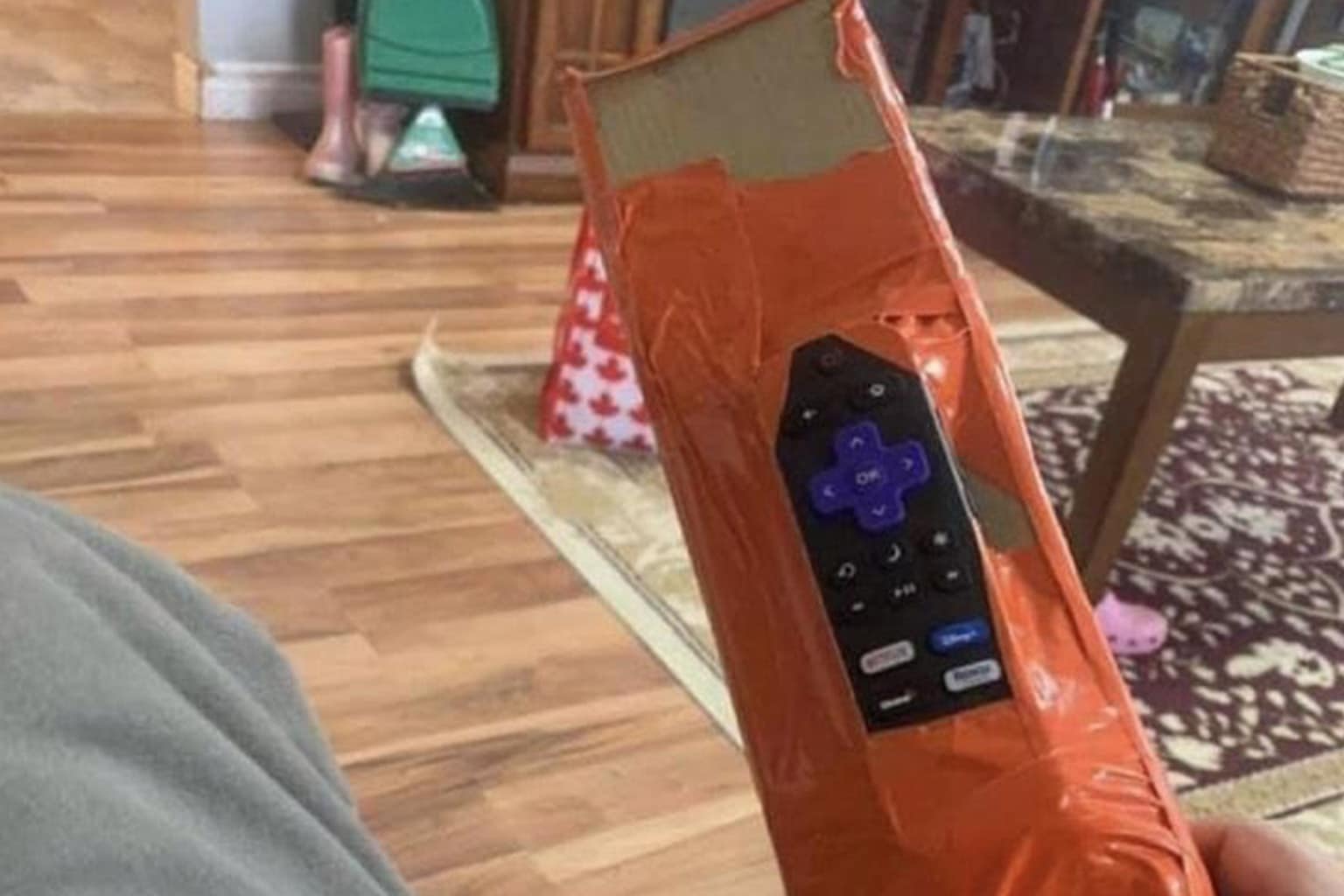 A classic memes gallery compiling the internet's most iconic historical humor and relatable format hits, highlighted by an elderly woman drinking a martini inside a gym weight room, a nostalgic tribute to the smartphone analog headphone jack, and a Roku remote taped to a massive cardboard shipping block.
