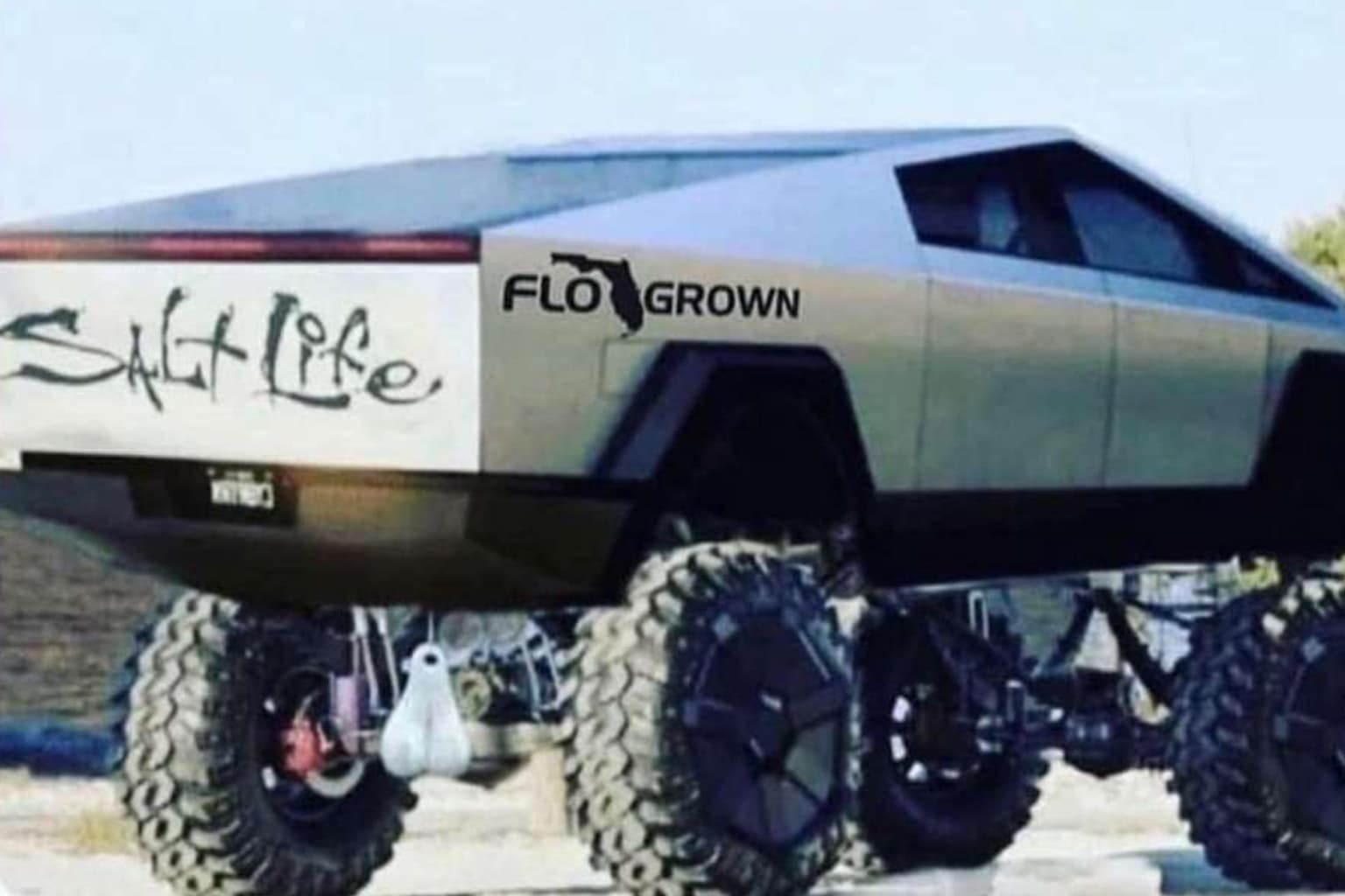 A classic memes gallery showcasing the internet's most unhinged hits, including a Tesla Cybertruck lifted on monster tires in Florida, a muscular frog in a top hat labeled "Phrog" left as a gift in an Airbnb, and Colonel Sanders leading a gang in the style of A Clockwork Orange.