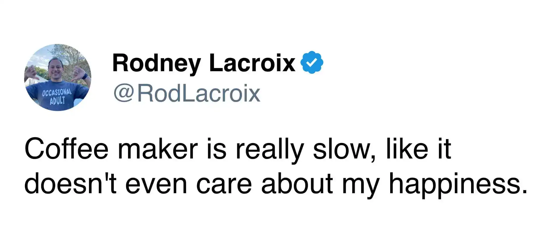 A frustrated coffee meme tweet from Rodney Lacroix complaining that his slow coffee maker clearly lacks empathy for his personal happiness.