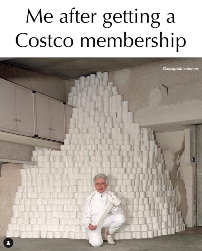 A vivid Costco meme showing a person in white athletic gear crouching in front of a gargantuan, ceiling-high fortress of toilet paper rolls stacked inside a garage.