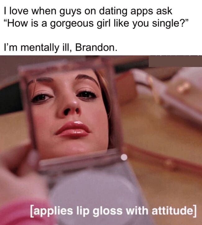 A text-based graphic explaining why an attractive profile remains single on matching platforms is paired with Lindsay Lohan as Cady Heron from Mean Girls looking into a compact mirror with the custom subtitle "[applies lip gloss with attitude]."