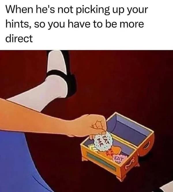 A cheeky dirty meme using a classic scene from Alice in Wonderland, showing Alice reaching into a treasure chest filled with "Eat Me" cookies to signal the need to be more direct with a partner.