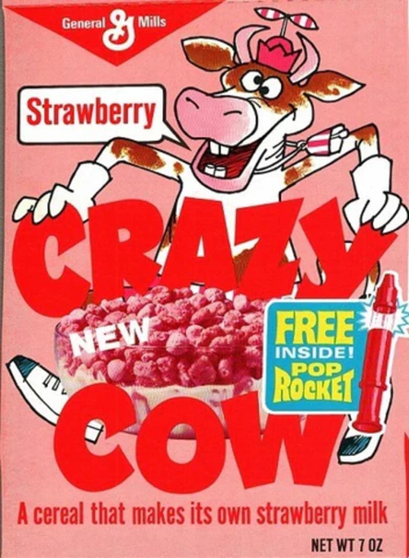 A pristine 1970s box of General Mills Strawberry Crazy Cow cereal captures a legendary entry among discontinued cereals, highlighting a wacky cartoon cow character and a promise to turn regular milk into strawberry milk.