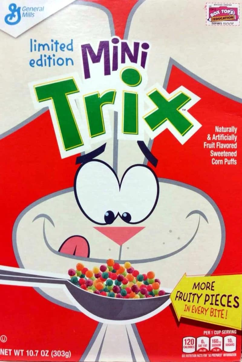 This limited-edition box of General Mills Mini Trix sweetened corn puffs shows the classic Trix Rabbit licking his lips over a tiny spoon of fruity pieces, a favorite memory of late-90s and early-2000s discontinued cereals.