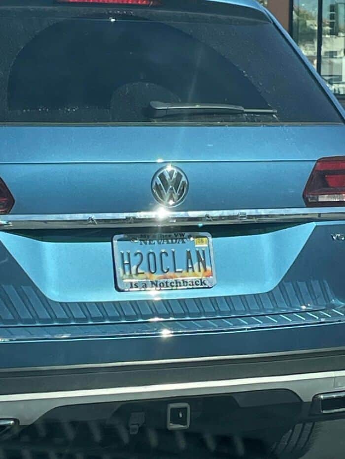 A Volkswagen car with a custom Nevada license plate that reads H2O CLAN.