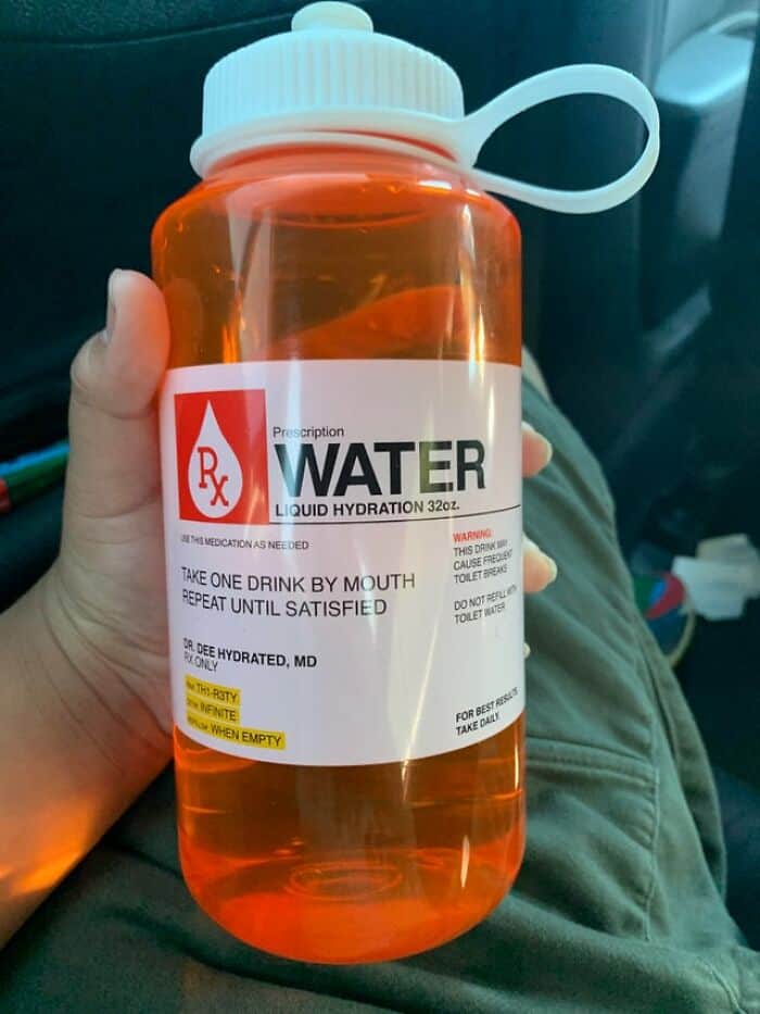 An orange water bottle designed with a humorous prescription medication label for liquid hydration.
