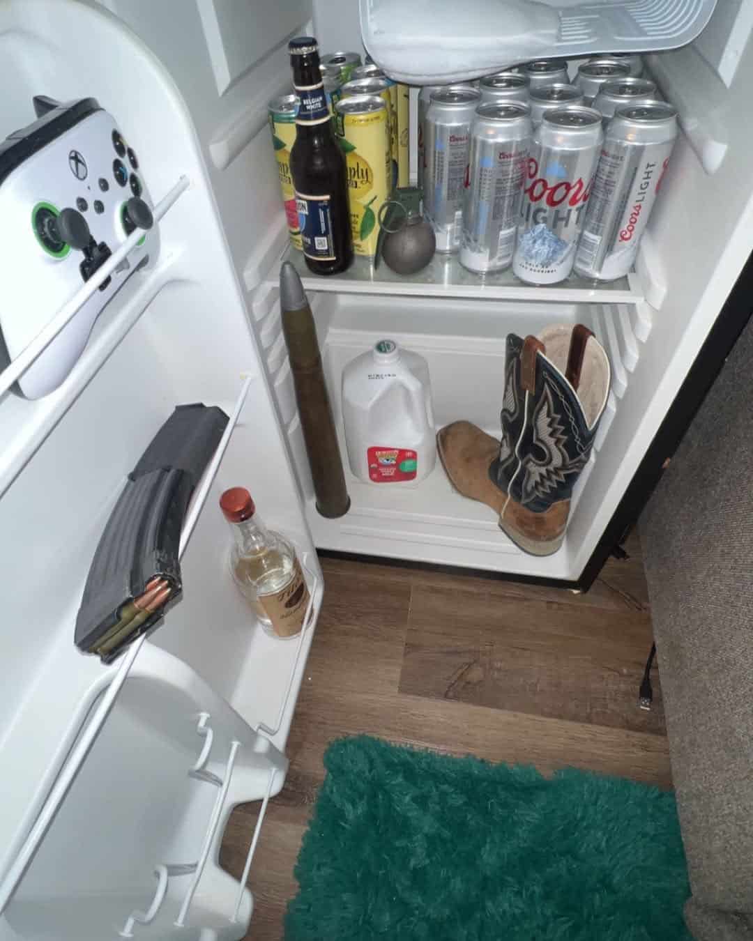 Mini fridge filled with beer, an Xbox controller, a grenade, and a cowboy boot.