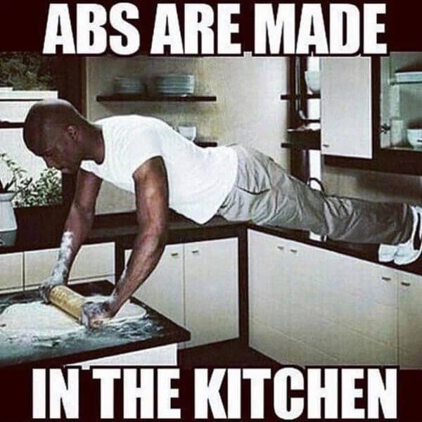 A funny fitness meme showing a man in a full plank position on a kitchen counter while using a rolling pin on dough.